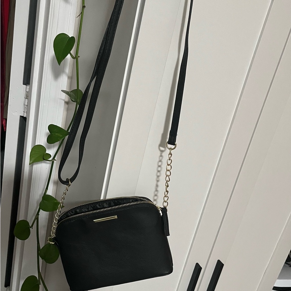 Small vinal black over shoulder bag .6”x 8”